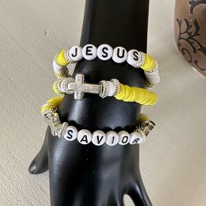 Beautiful homemade clay beaded bracelets with silver accents and cross
